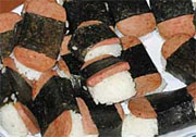Spam musubi! Delicious, dude! Hey, there! Give us a taste! Spam musubi! Broke da mout, brah! Ho, cuz! We like sample.