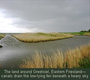 The land around Greetsiel, Eastern Friesland--canals drain the low-lying fen beneath a heavy sky